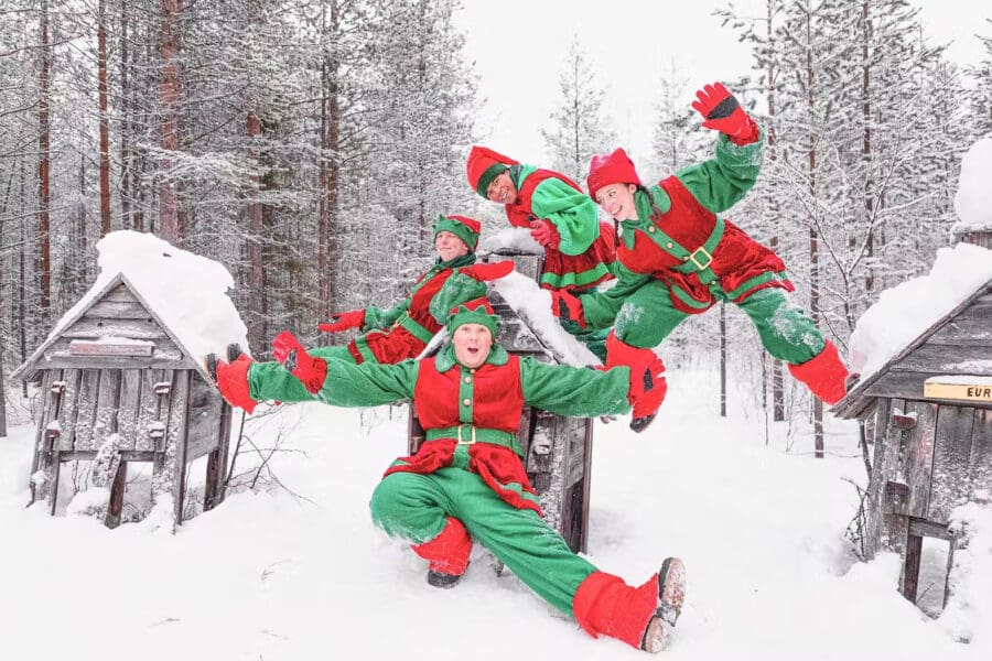 Elves playing in Santa's Village in Lapland.